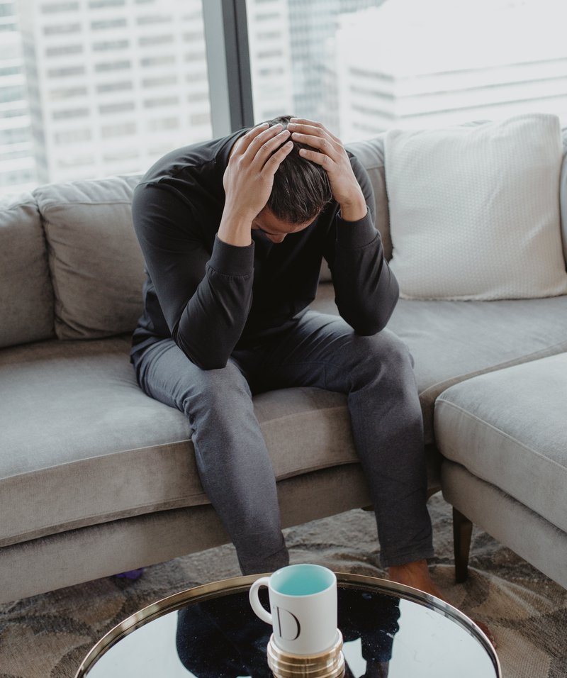 person-sits-with-there-head-in-their-hands.jpg